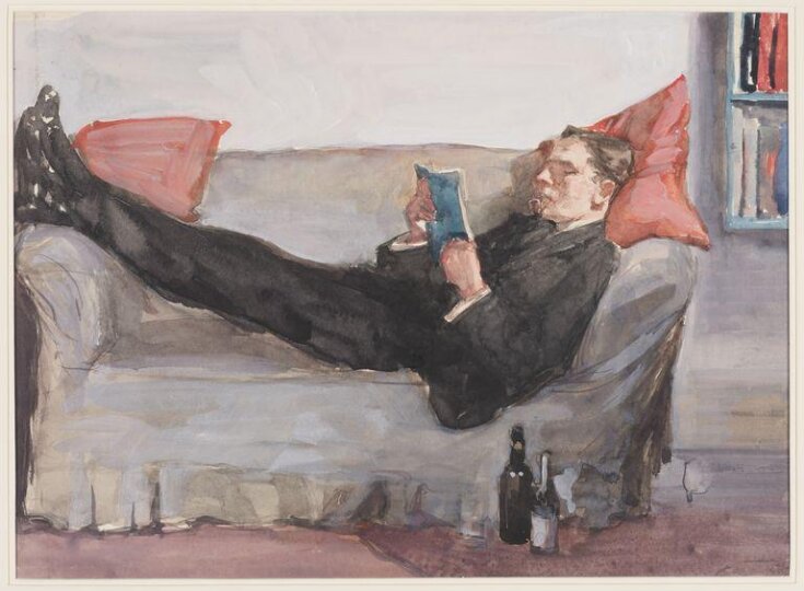 A man reading on a sofa top image