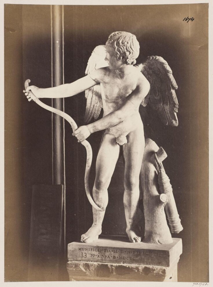 Sculpture - Statue of Cupid with his bow, in the Capitoline Museum. top image