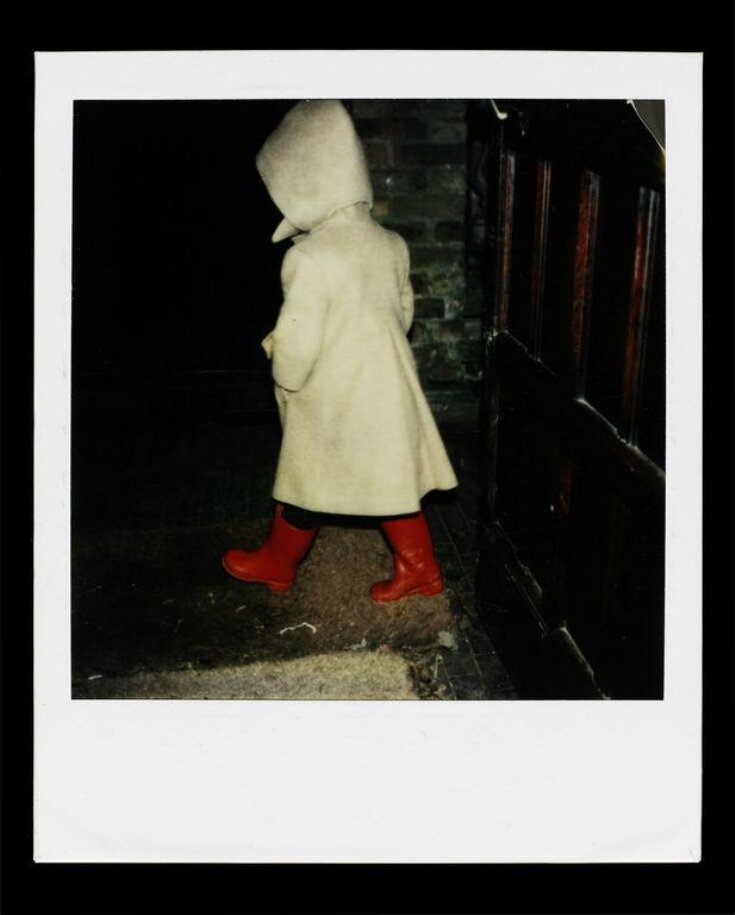 Untitled (Polaroid of child in light coloured coat with red wellington boots) top image