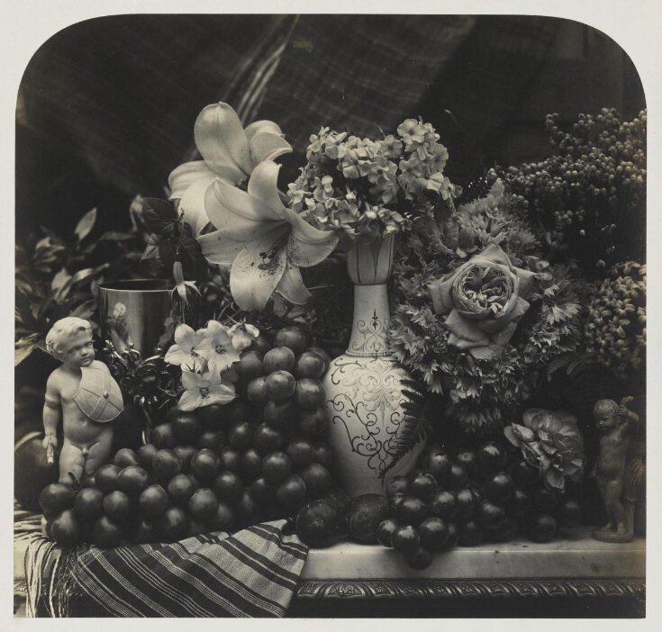 Still life with vase, flowers and fruit top image
