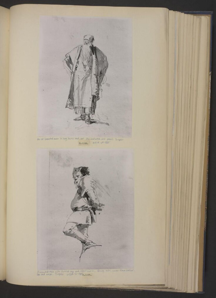 An old bearded man in long tunic and coat top image