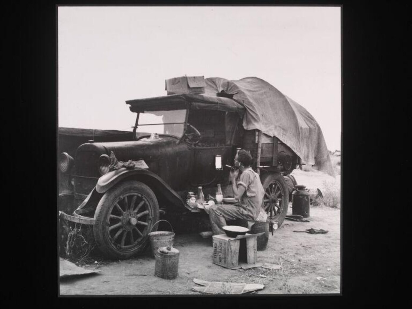 Dorothea Lange, Potato picker in camp near Shafter, California
