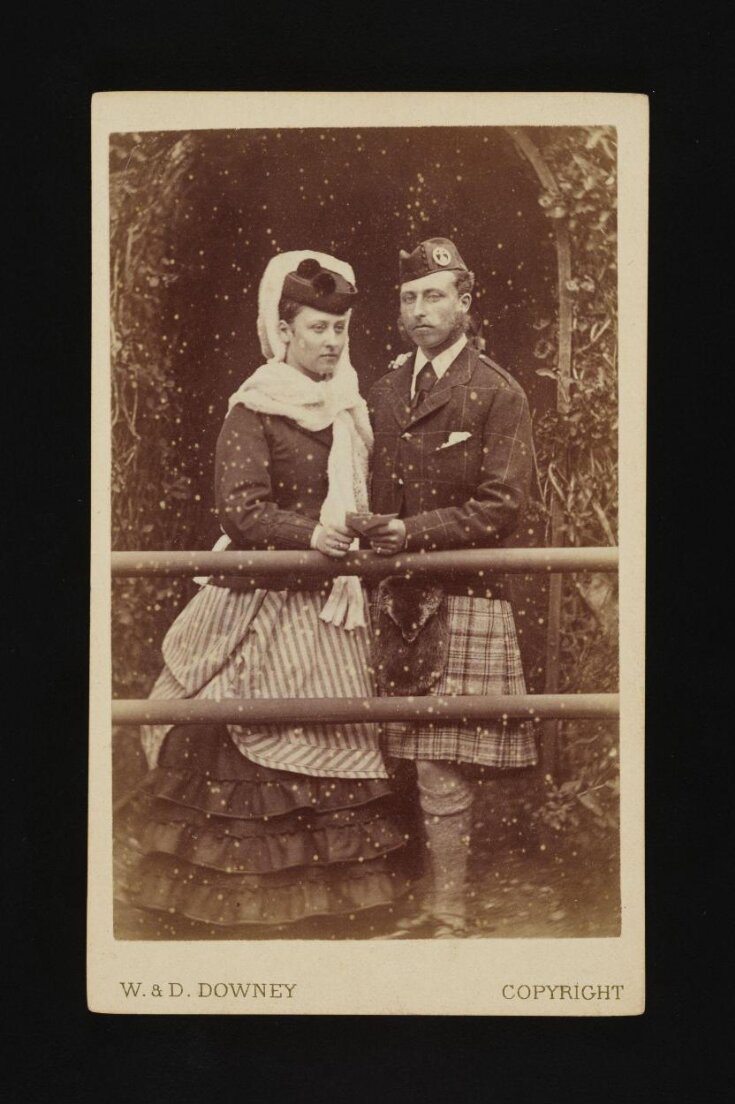 A portrait of a man and woman top image