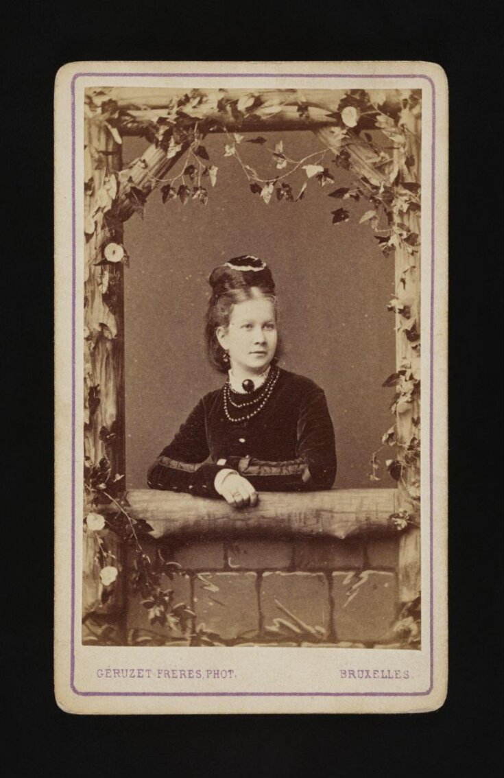 A portrait of a young woman top image