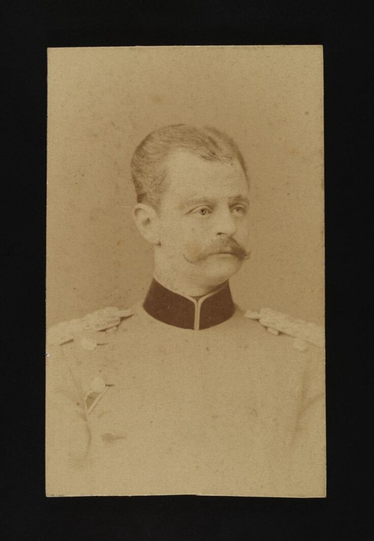 A portrait of a man in military uniform top image