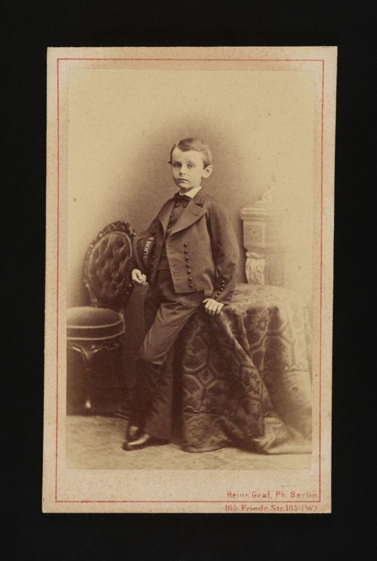 A portrait of a young boy top image