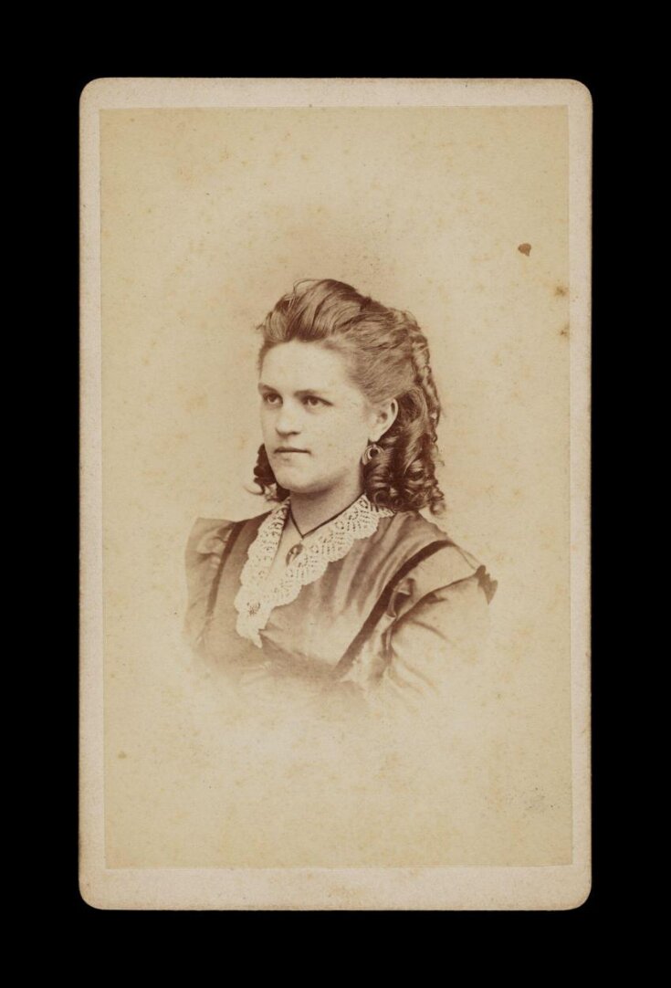 A portrait of a young woman top image