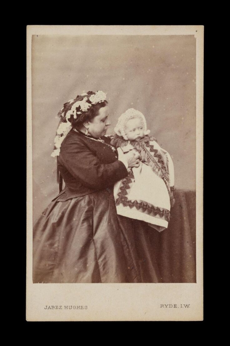 A portrait of a woman and baby top image