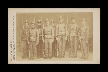 A portrait of nine men in military uniform