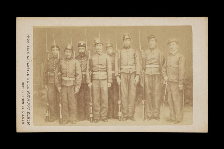 A portrait of nine men in military uniform image