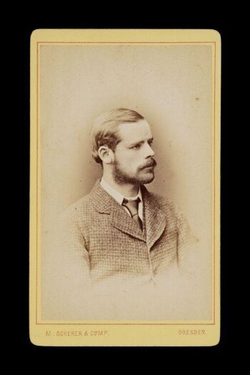 portrait of gentleman in profile in a checked suit