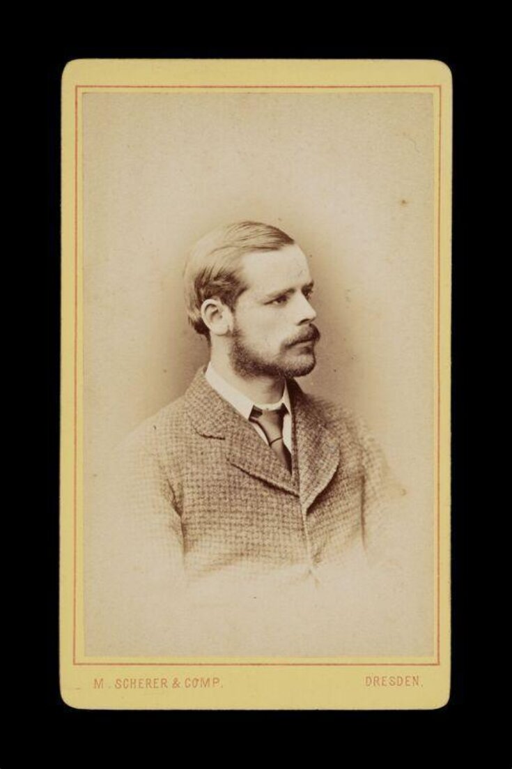 portrait of gentleman in profile in a checked suit top image