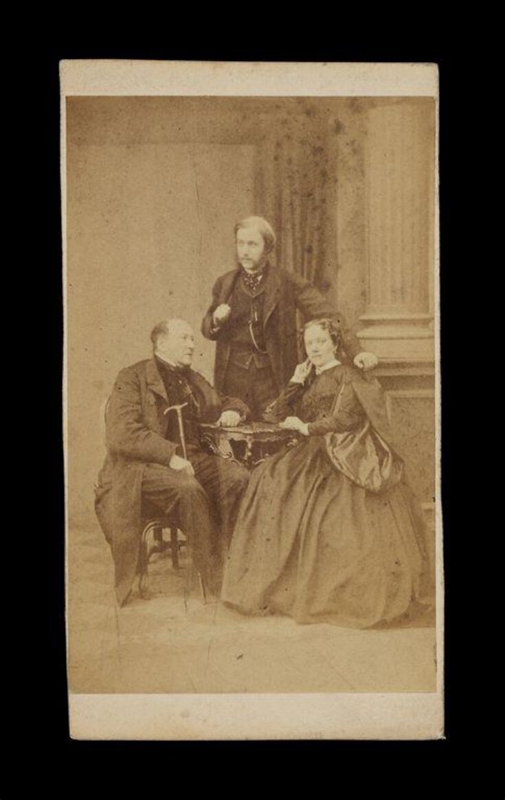 image of two men and a woman at a table image