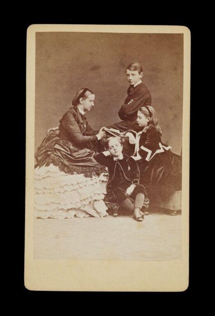 portrait of a mother and three children top image