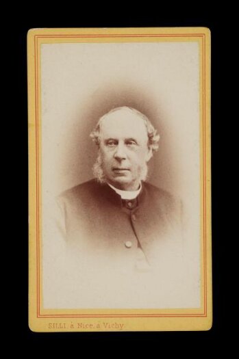 Head portrait of a man wearing a dark jacket and shirt