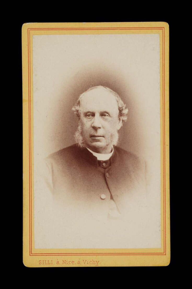 Head portrait of a man wearing a dark jacket and shirt top image