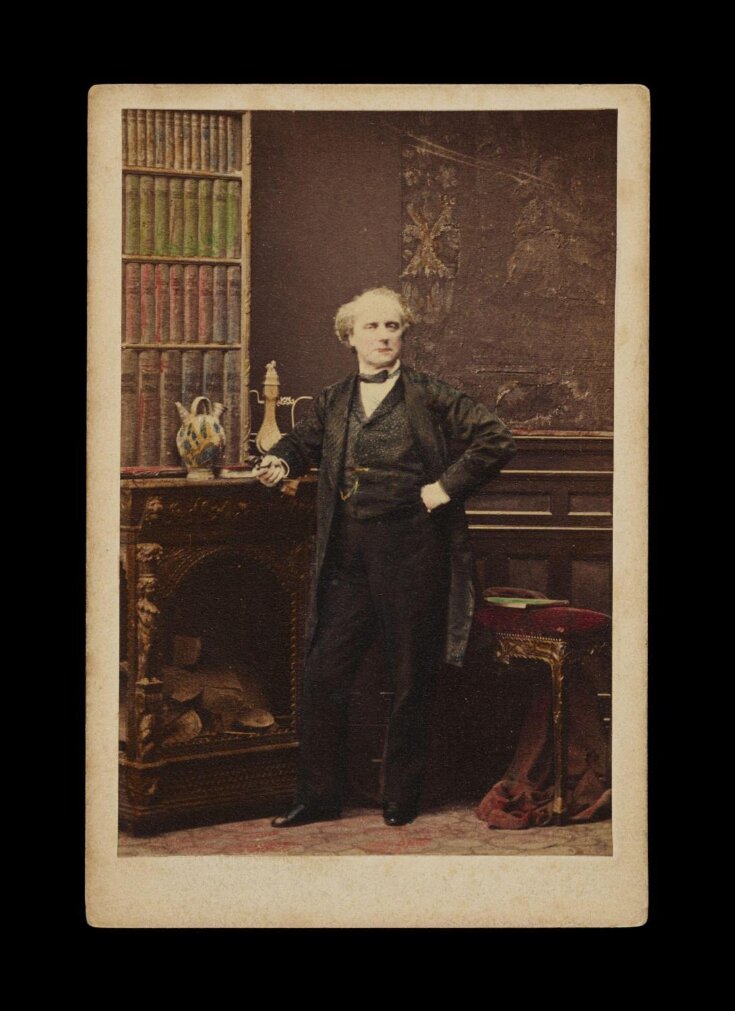 Portrait of a man leaning on the fireplace image