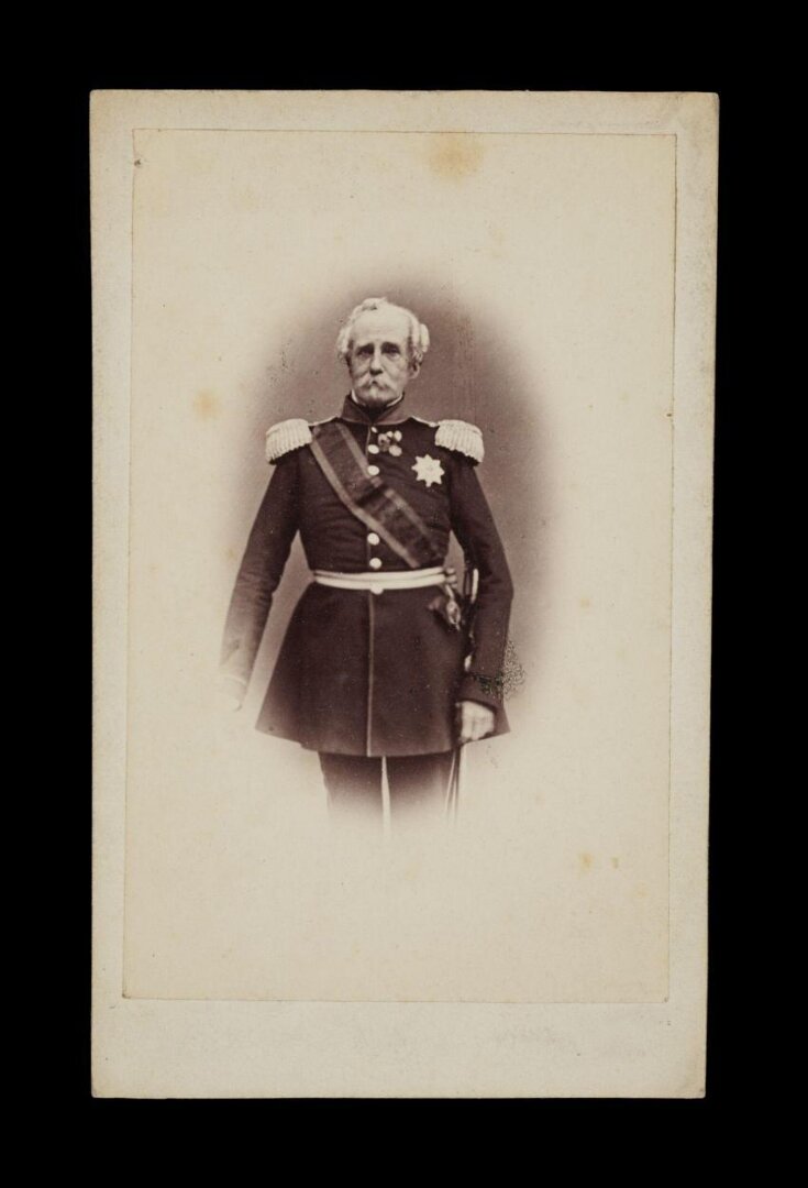 A portrait of a man in military uniform top image