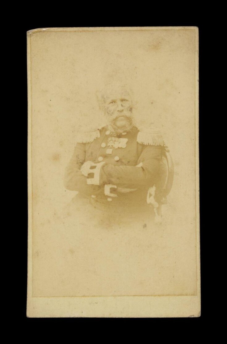 A portrait of a man in military uniform top image