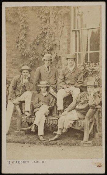 A photograph of a group of five men