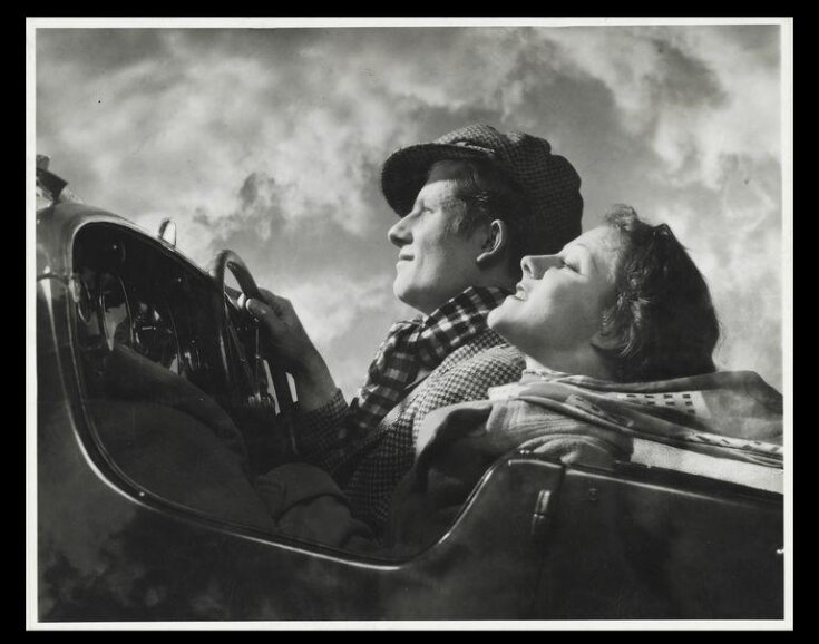 Couple in an open top car top image