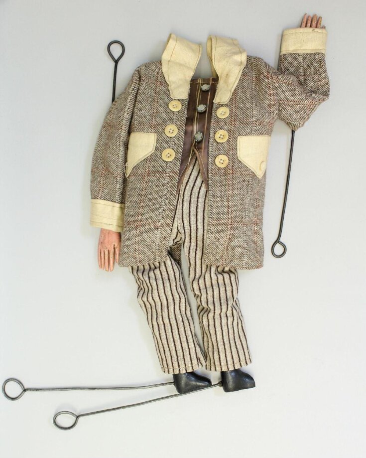 'Living marionette' of a sharp-suited man top image