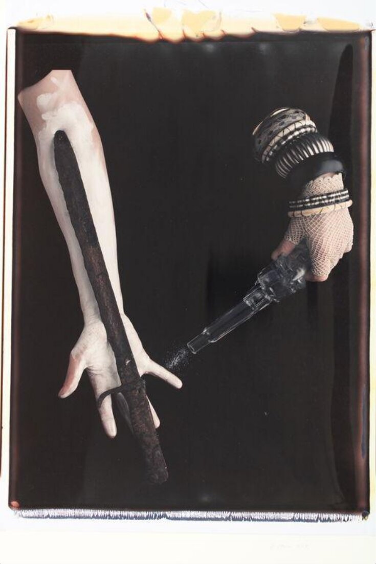 Untitled [photograph of hands, sword and gun] top image