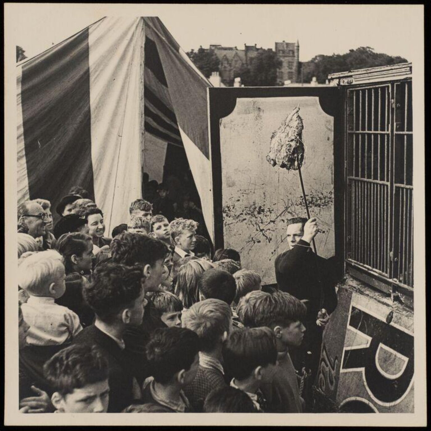 Hinde, John Wilfrid, crowd of people standing in front of a cage waiting for an animal to be fed