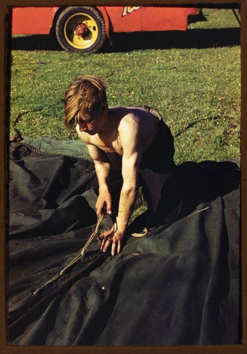 Hinde, John Wilfrid, view of a young man working on a canvas tent