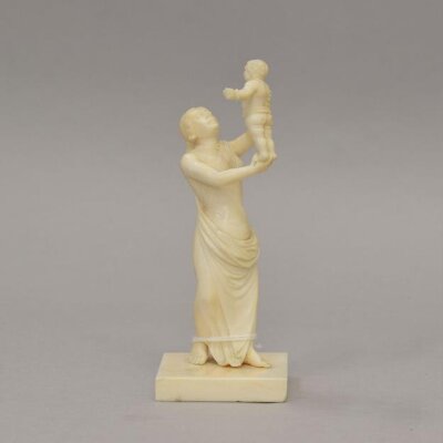 Woman holding up an infant, 19th century