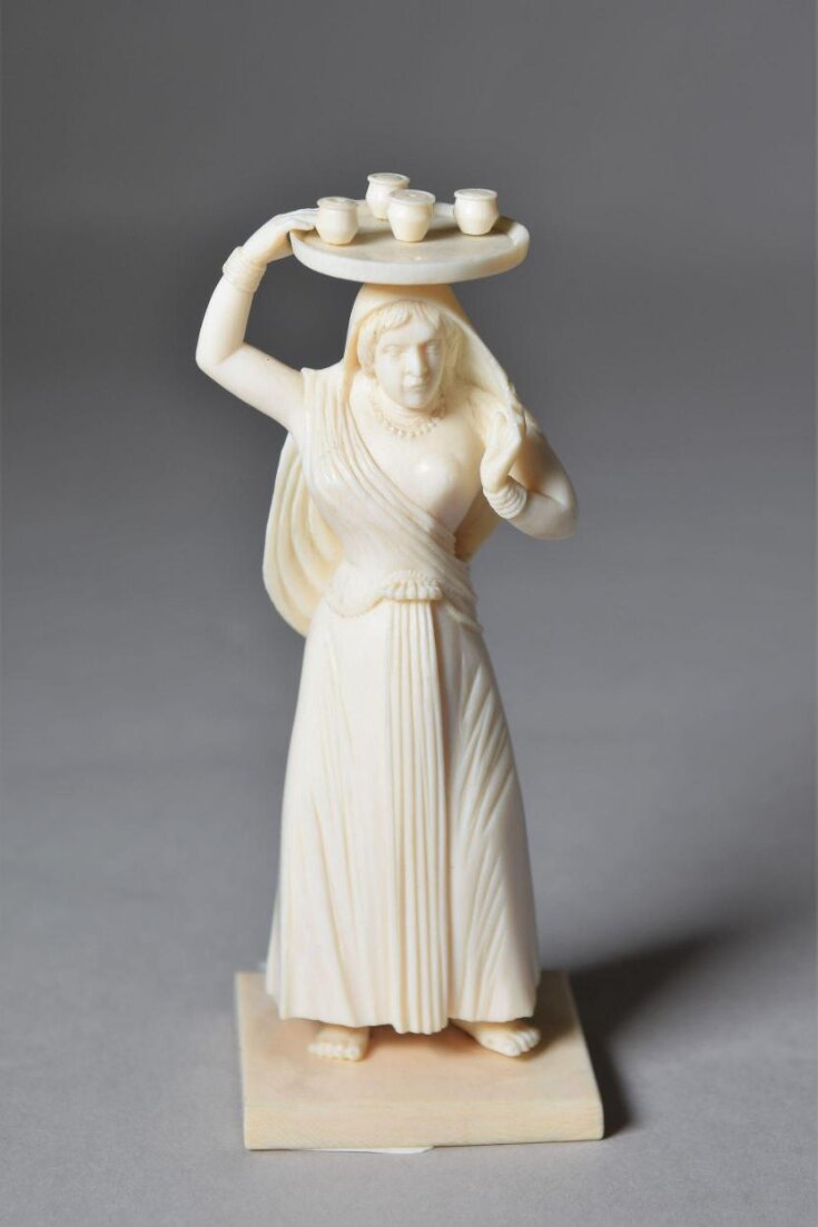 Woman carrying tray top image