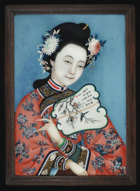 Woman figure holding a fan