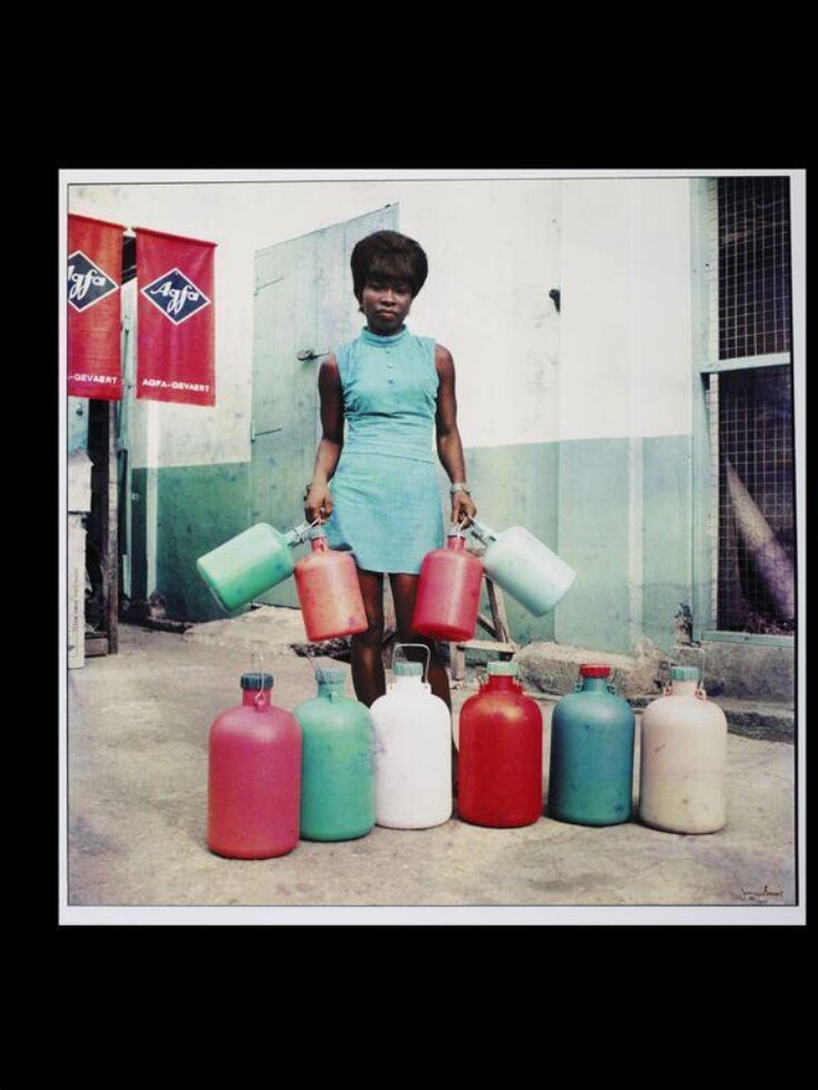 Sick-Hagemeyer shop assistant with bottles, taken as a colour guide, Accra  top image