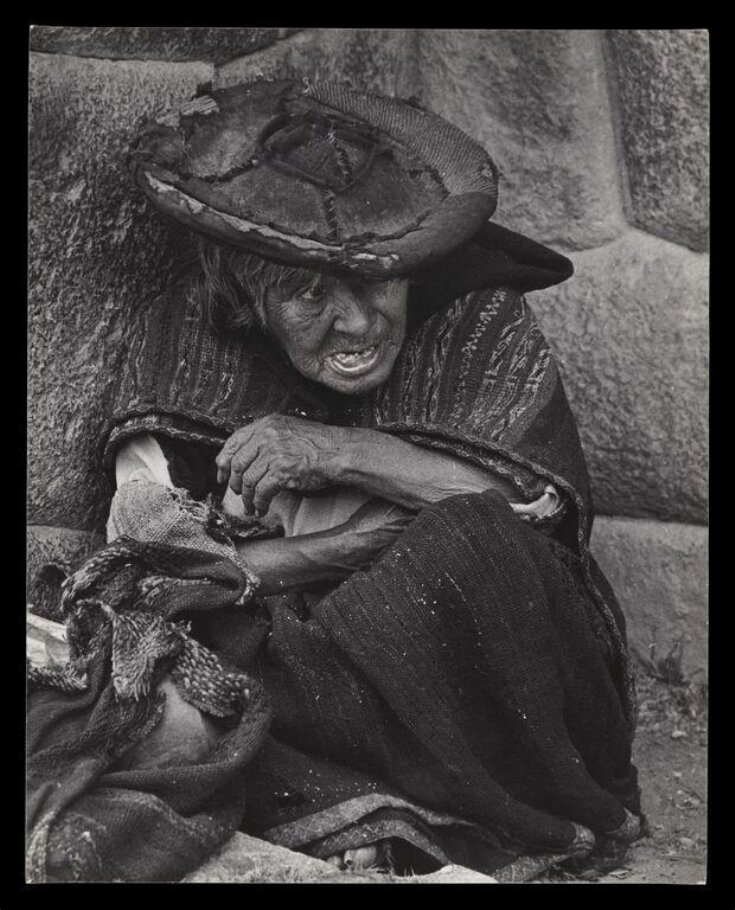 Old Woman Seated against Ancient Inca Wall in Market at Chinchero, Peru