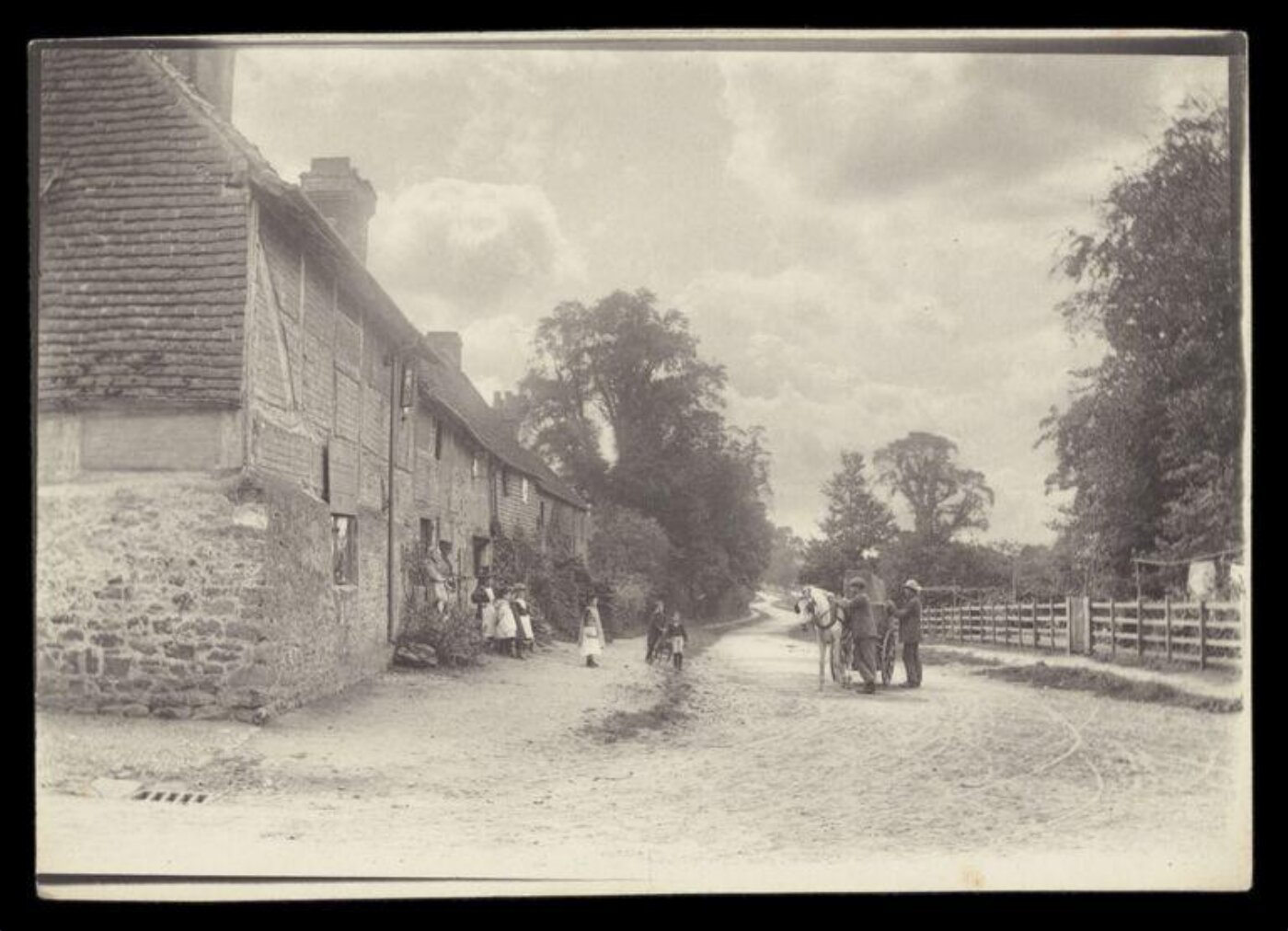 Gale, Lt. Col. Joseph, Two men, a horse and children outside a row of houses