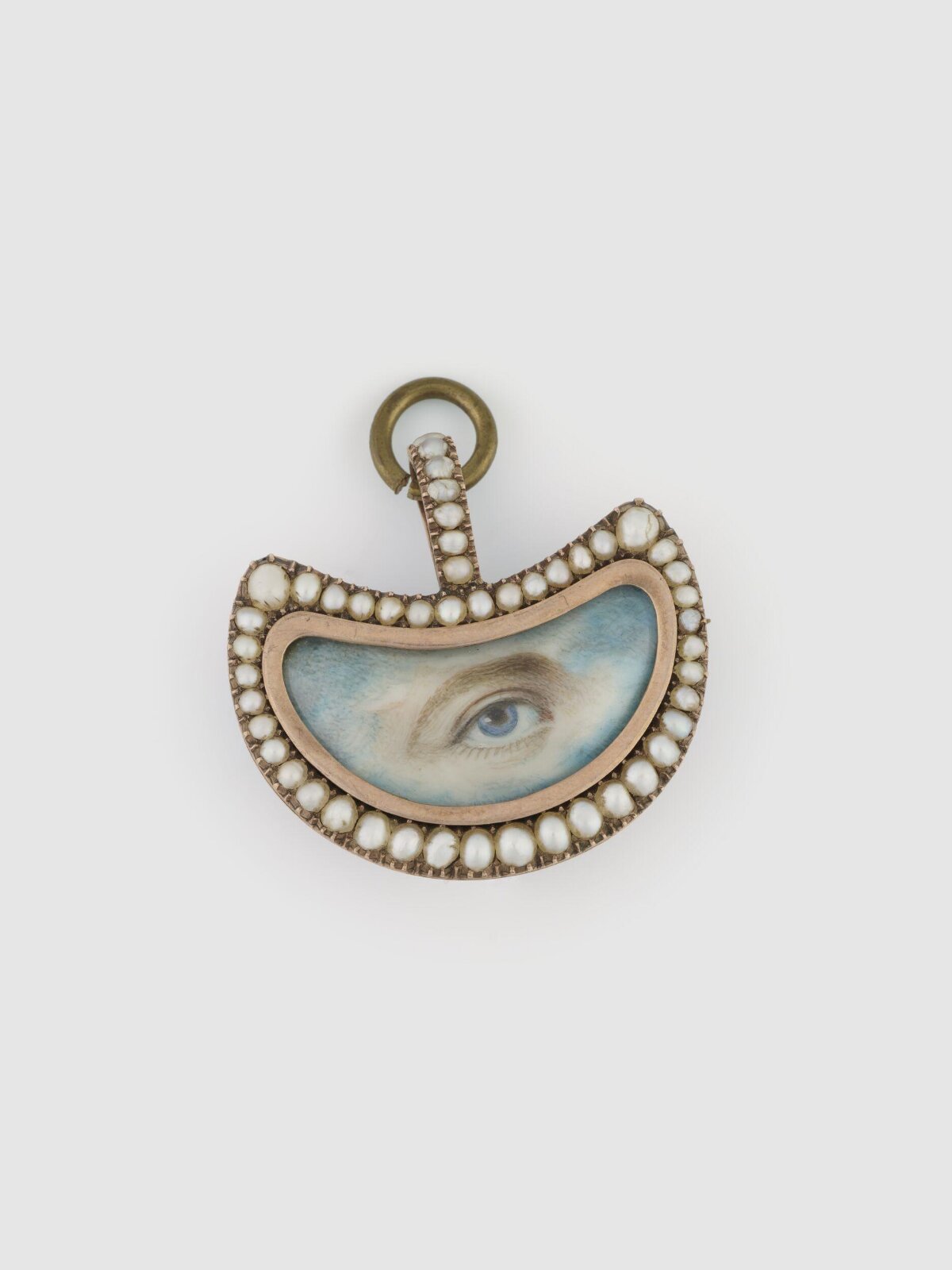 An Eye Miniature in a crescent shaped setting, early 19th century