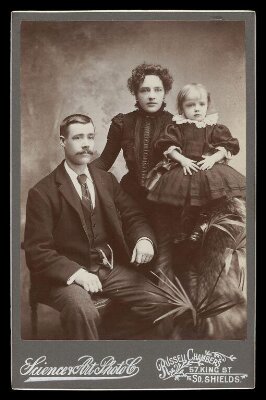 Portrait of a man, woman and child