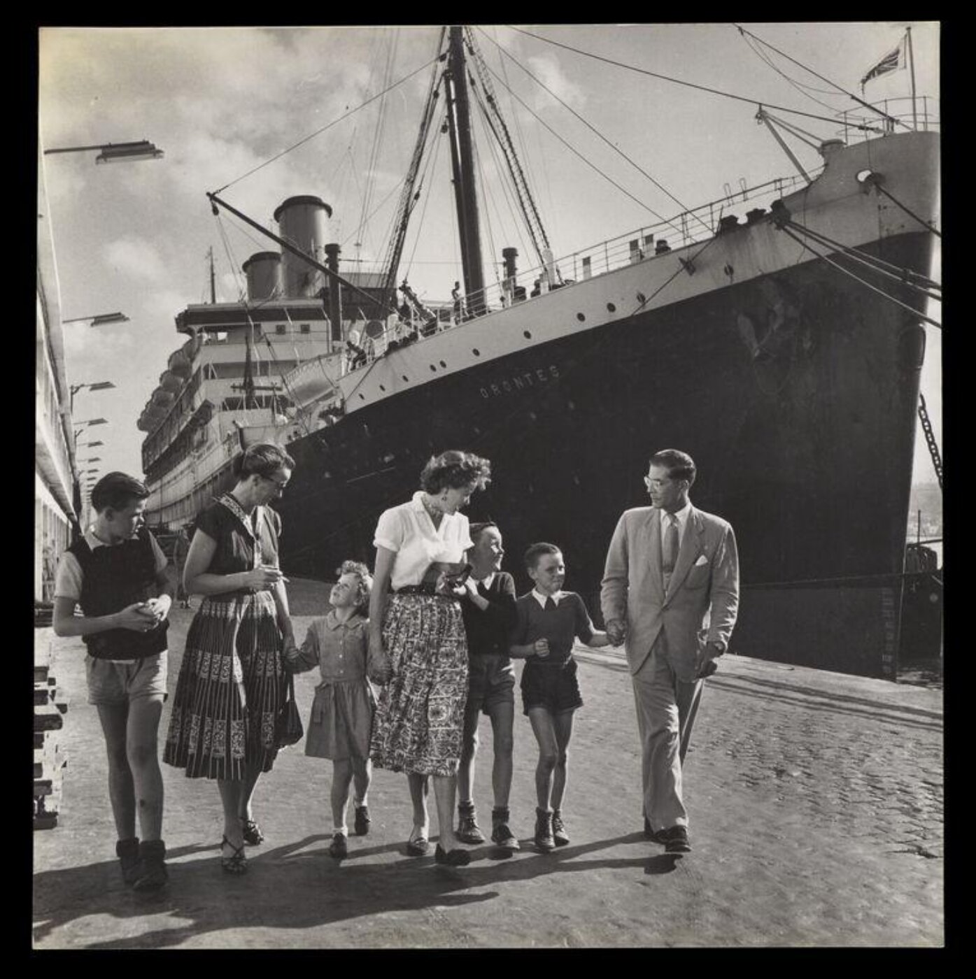 Hardy, Bert, Five children stow away, sail 10,000 miles, to each A MOTHER'S ARMS