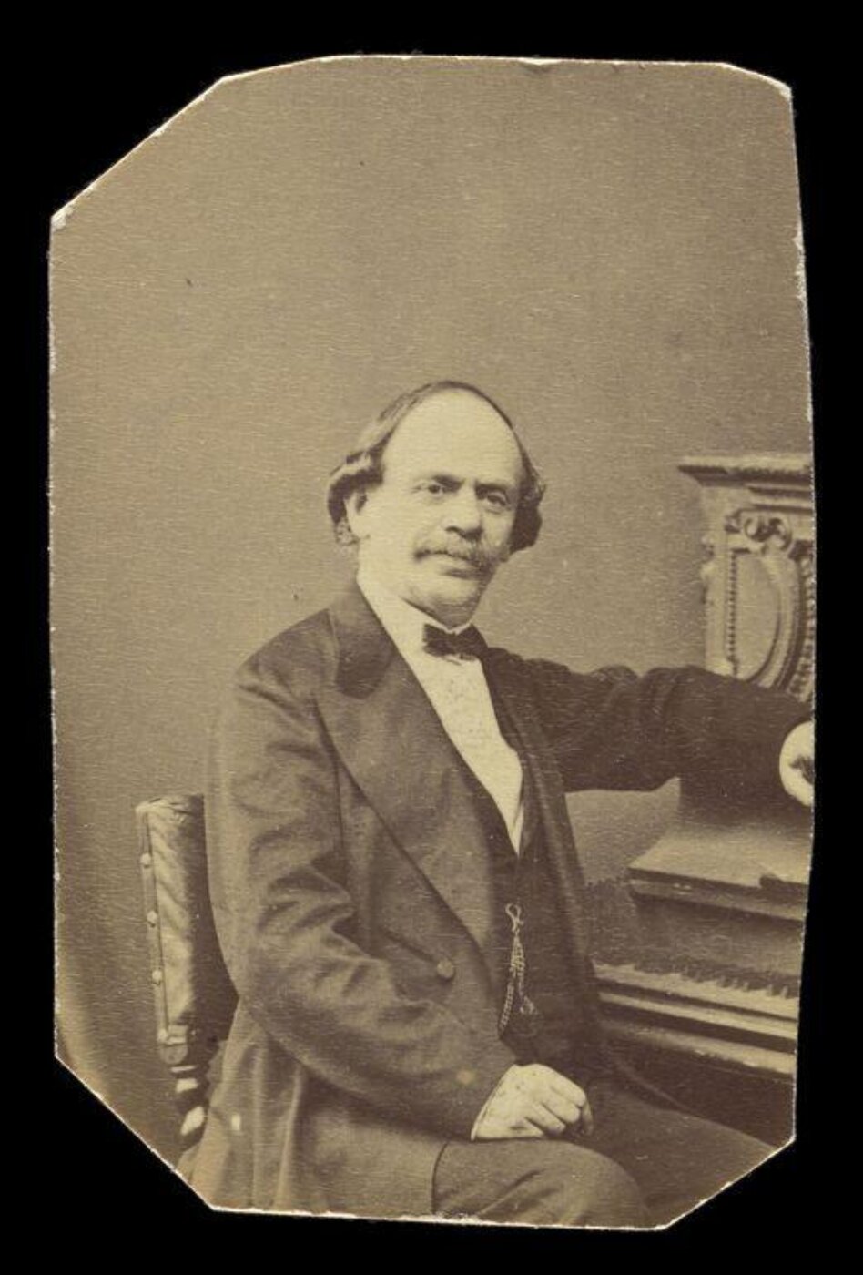 London Stereoscopic and Photographic Company, A portrait of a man at piano