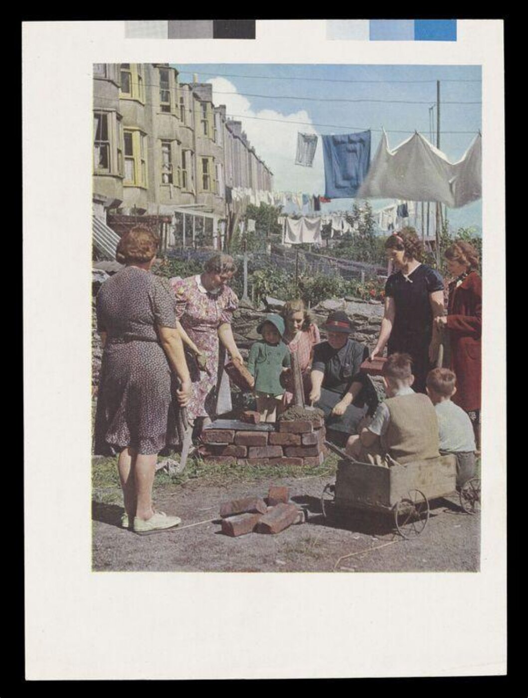 Hinde, John Wilfrid, W.V.S. Worker Demonstrating How to Build an Emergency Oven