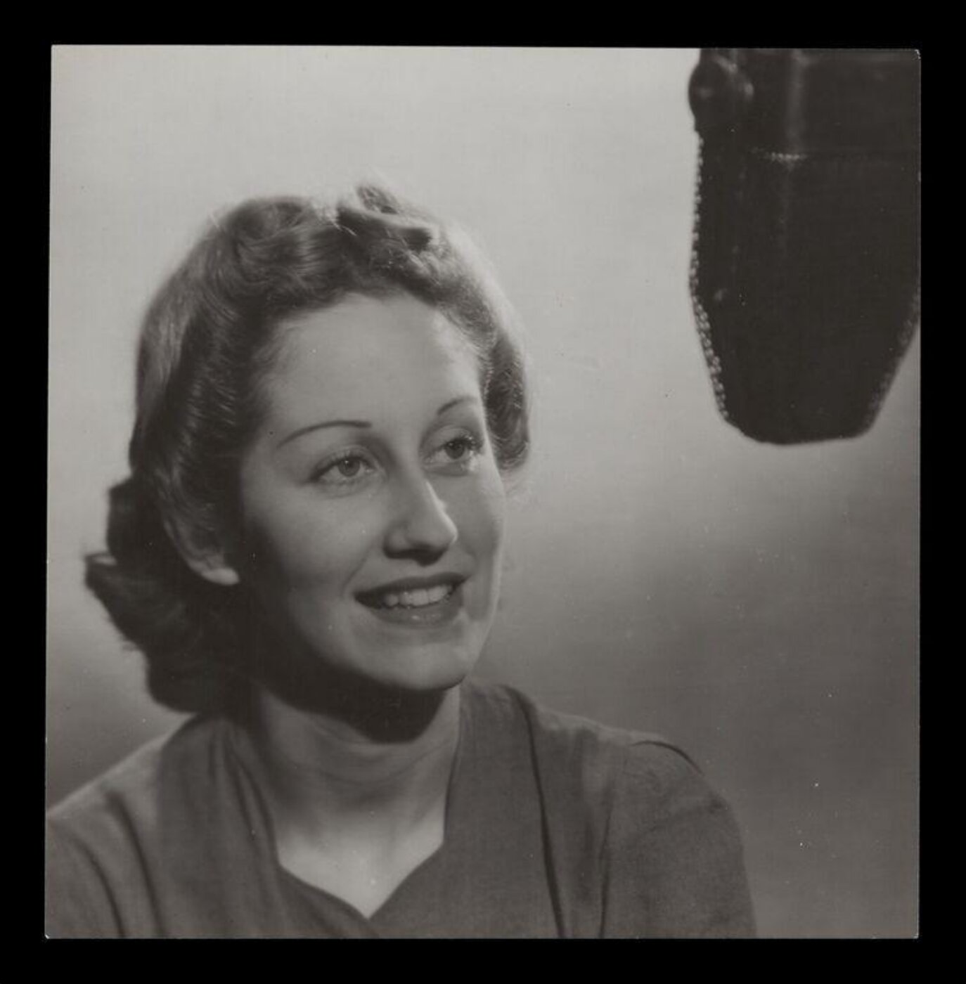 Hinde, John Wilfrid, Woman Sitting at a Microphone