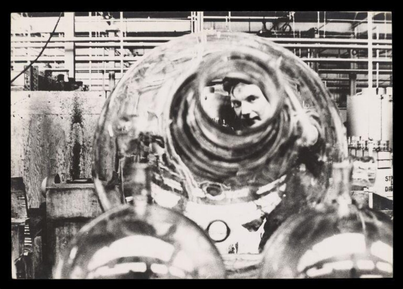 Jarvis, Don, Man Looking Through a Large Glass Sphere